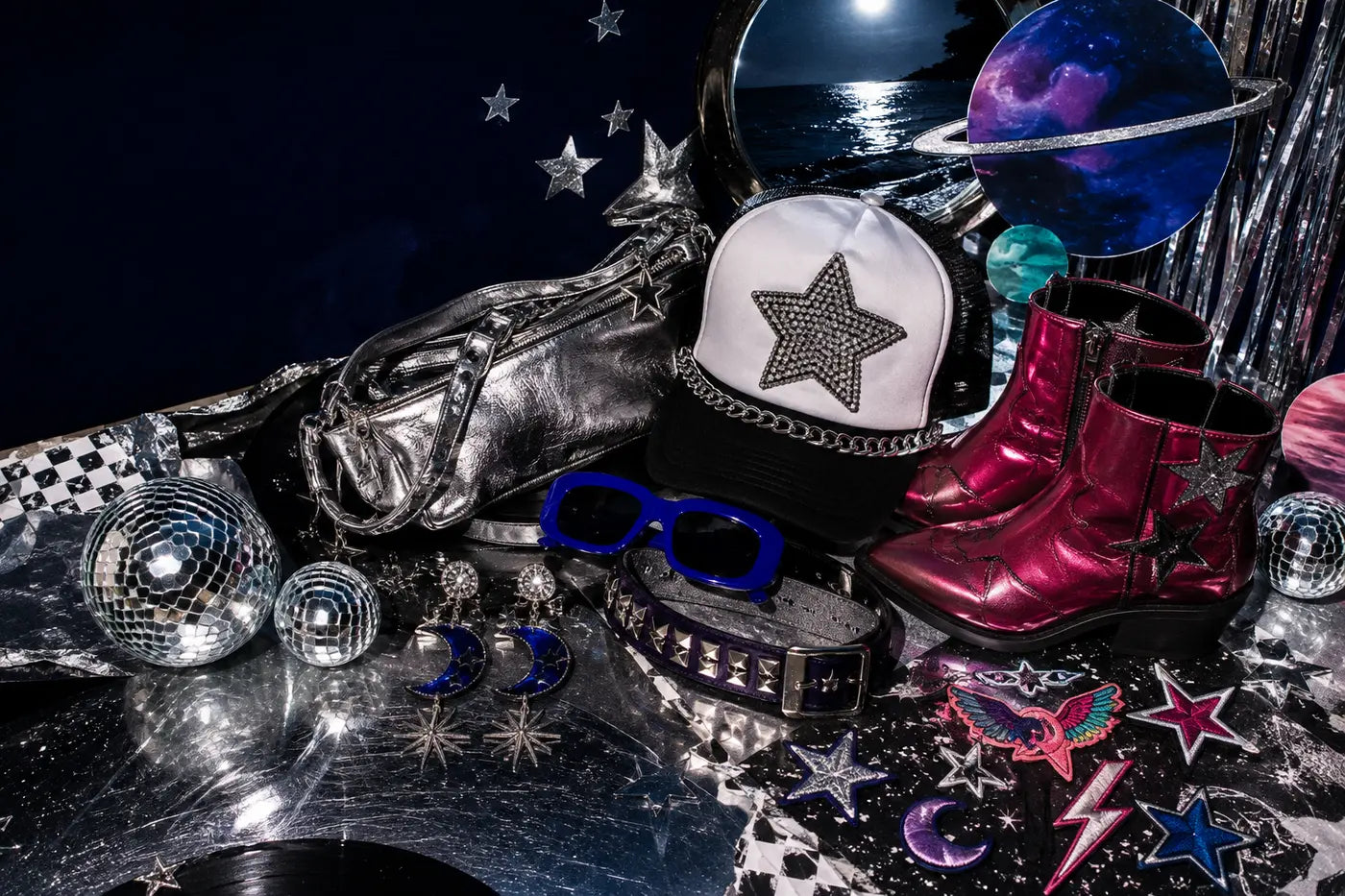 One customized trucker hat surrounded by patches, chains, chrome accessories, and rock-and-roll details